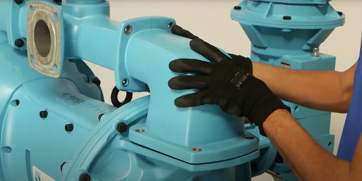 An electric diaphragm pump being serviced